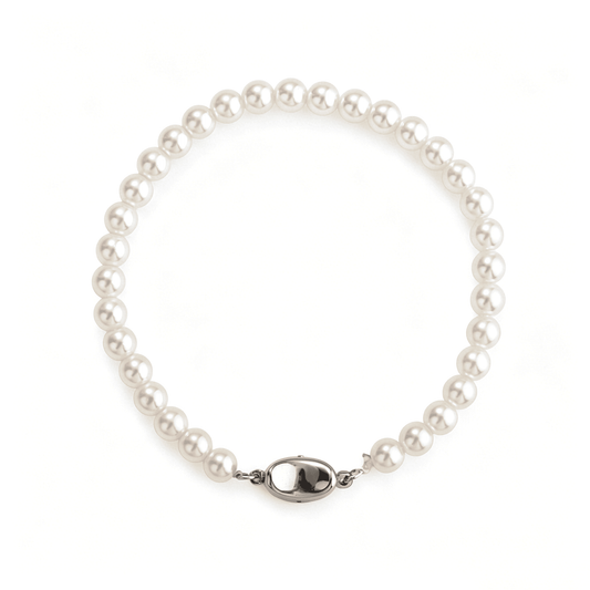 Flat lay view of Ever P. vintage bracelets collection, showcasing the interlocked gold chain and 5mm pearl bracelet design.