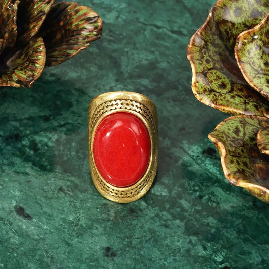 Top down flat lay view of Ever P. vintage gold ruby ring alternative, highlighting the 3.8x2.1cm oversized red stone ring.