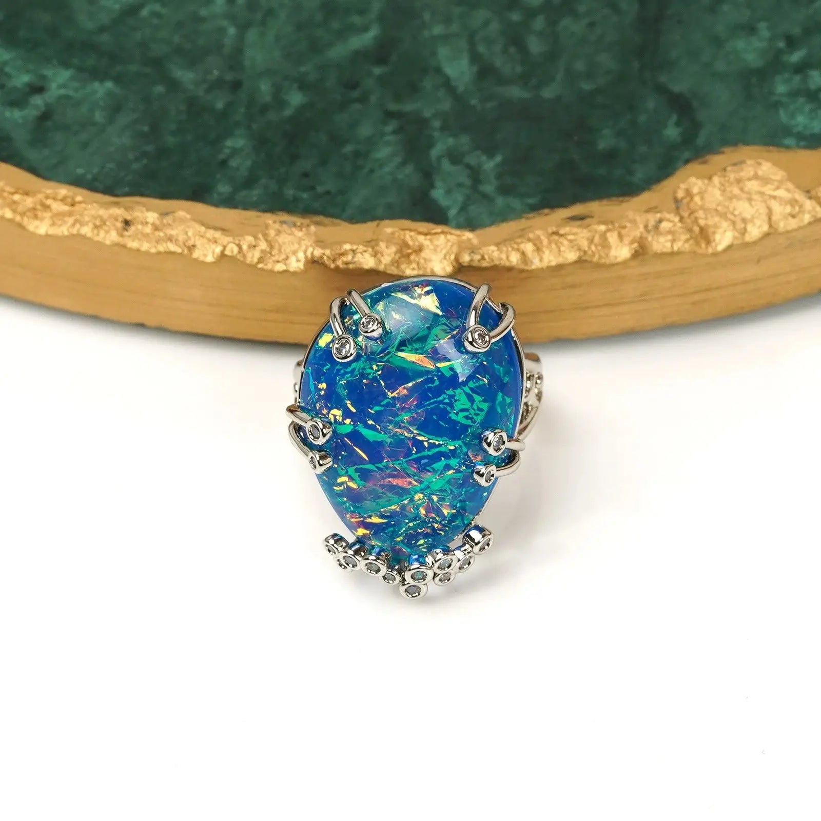Front view of Ever P. vintage gold opal ring, showcasing the bold 2.2x2.6cm geometric blue fire stone.