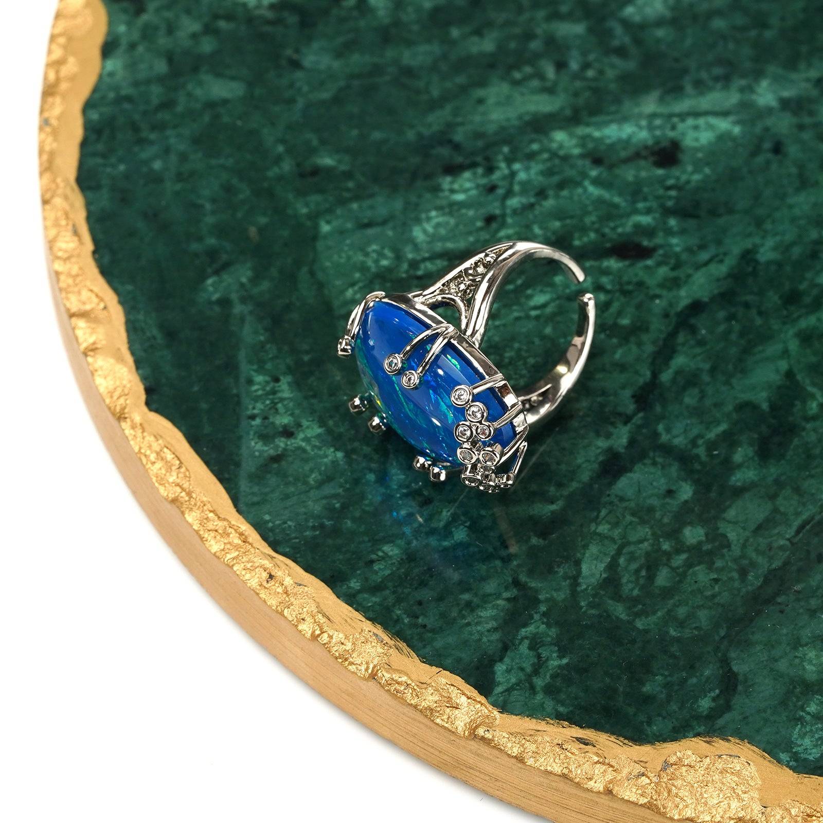 Side perspective highlighting the intricate crown prong setting and the secure adjustable ring band.