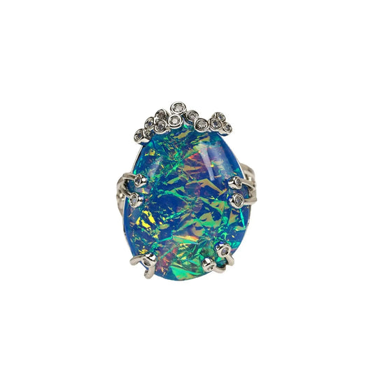 Studio portrait displaying the brilliant iridescent flashes of the vintage court style cocktail ring for women.