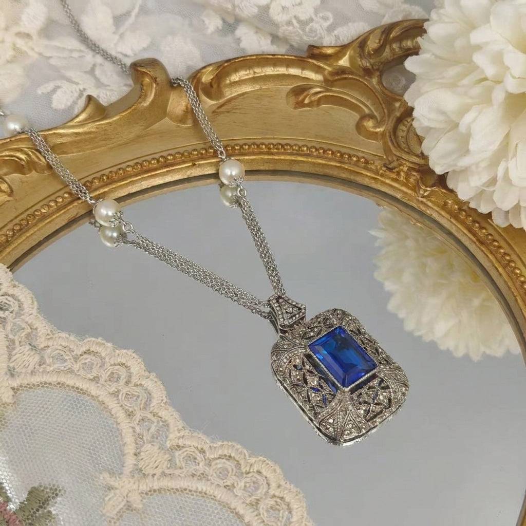 Scale view of the Ever P. vintage statement necklace with a royal blue aesthetic.