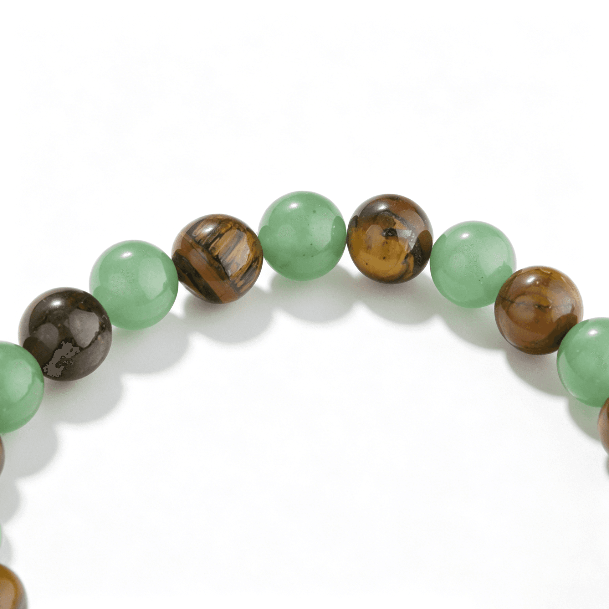 Ever P. vintage inspired healing crystal bracelet with rare brown green strawberry quartz, presented in a minimalist nature-themed scene.