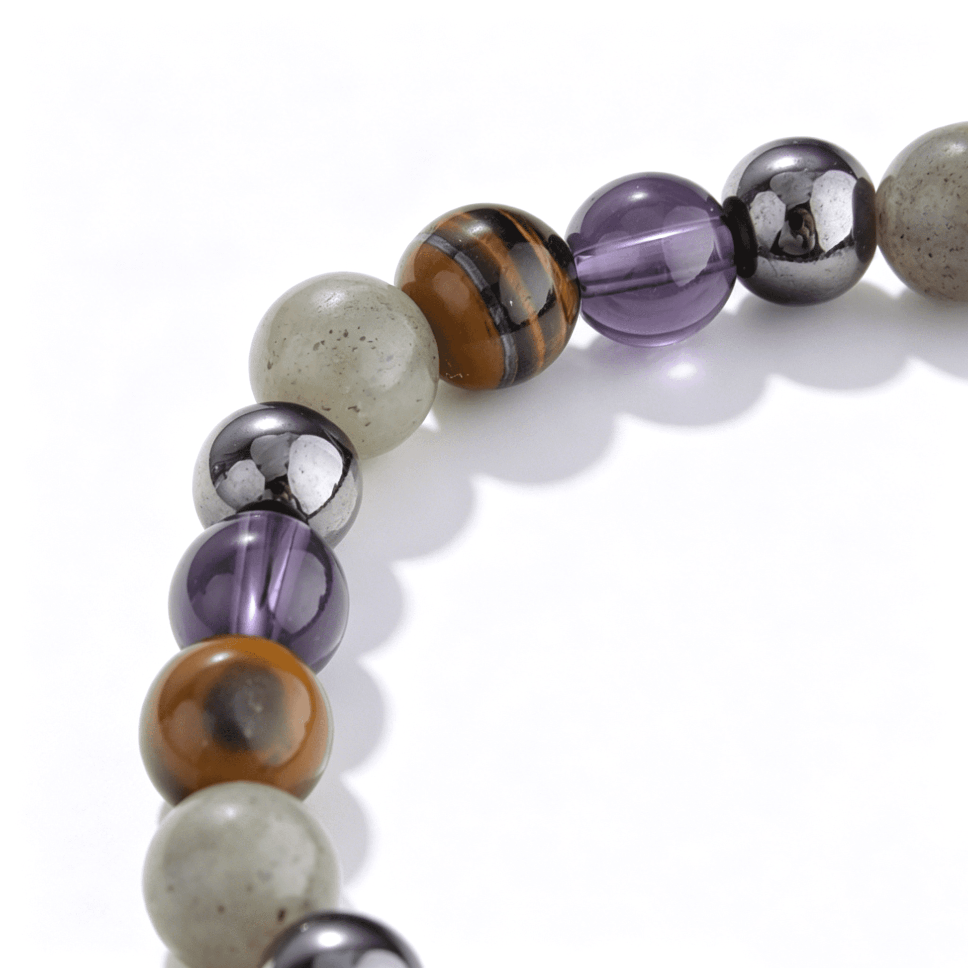 A collection of Ever P. gemstone bracelets showcasing the rare and elegant violet hues of natural strawberry quartz.