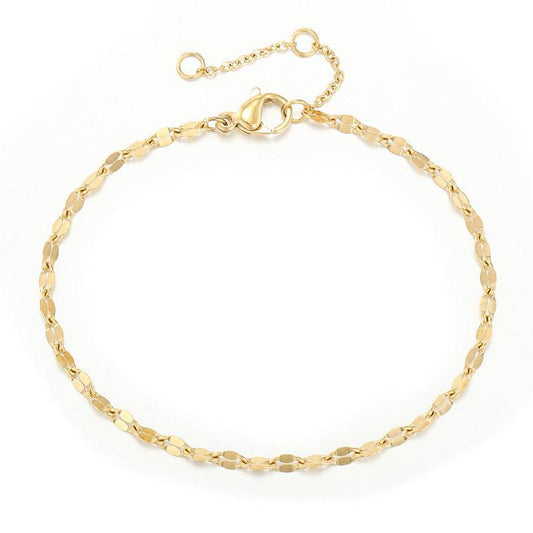 Gold flat link bracelet with lobster clasp and three-centimeter extender on white