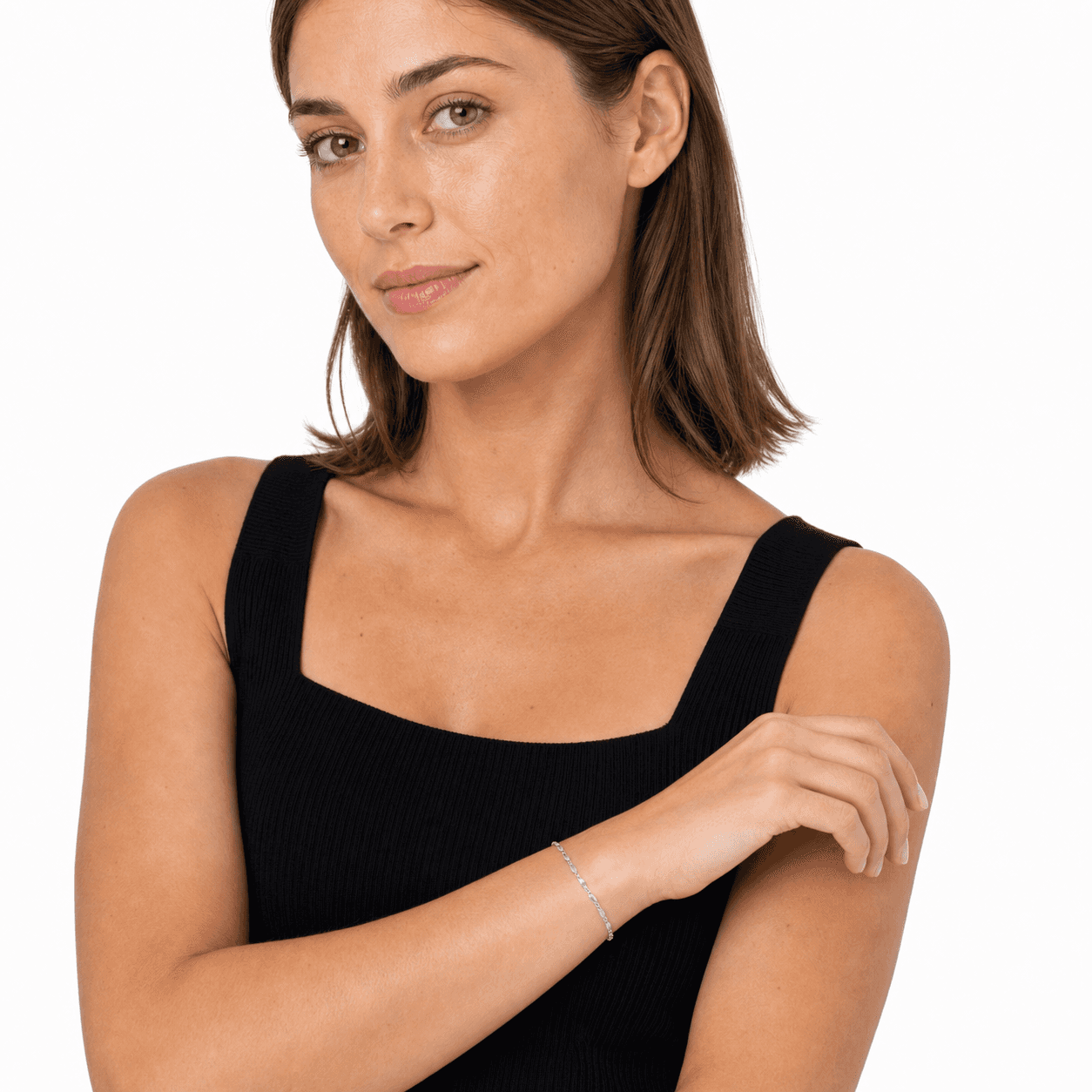 Woman wearing a silver stainless steel bracelet in a white-studio portrait