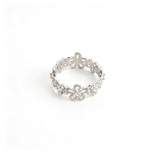 Front studio shot of the silver plated floral filigree eternity ring with shimmering cz stone centers.