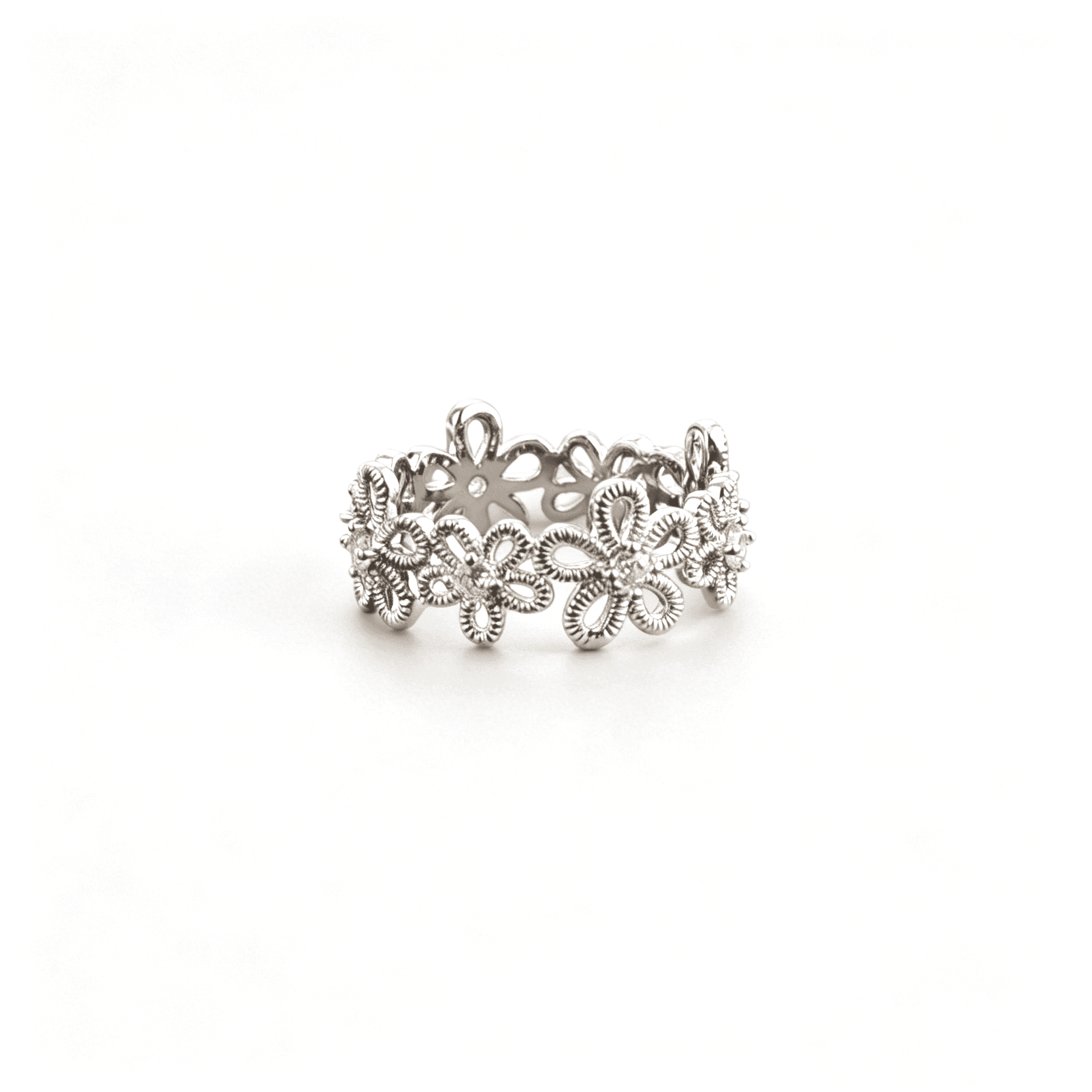 Detailed side perspective of Ever P. vintage cottagecore openwork flower ring highlighting the micro cz crystal inlays.
