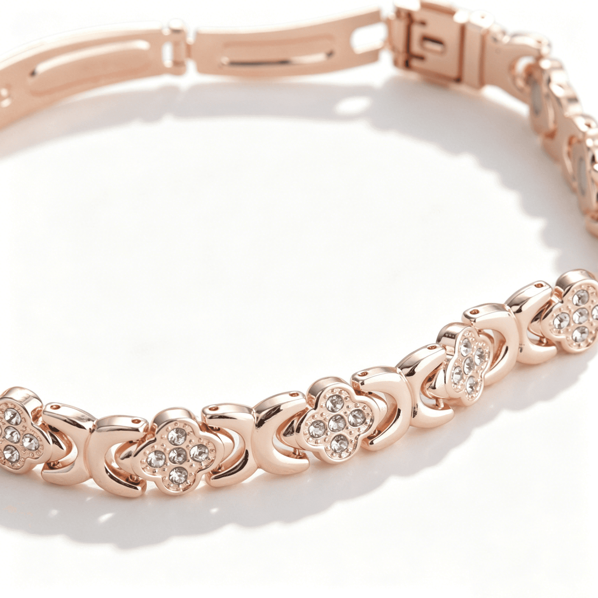 An angled view of the dainty rose gold clover bracelet, showcasing the brilliance of the micro-set crystals.