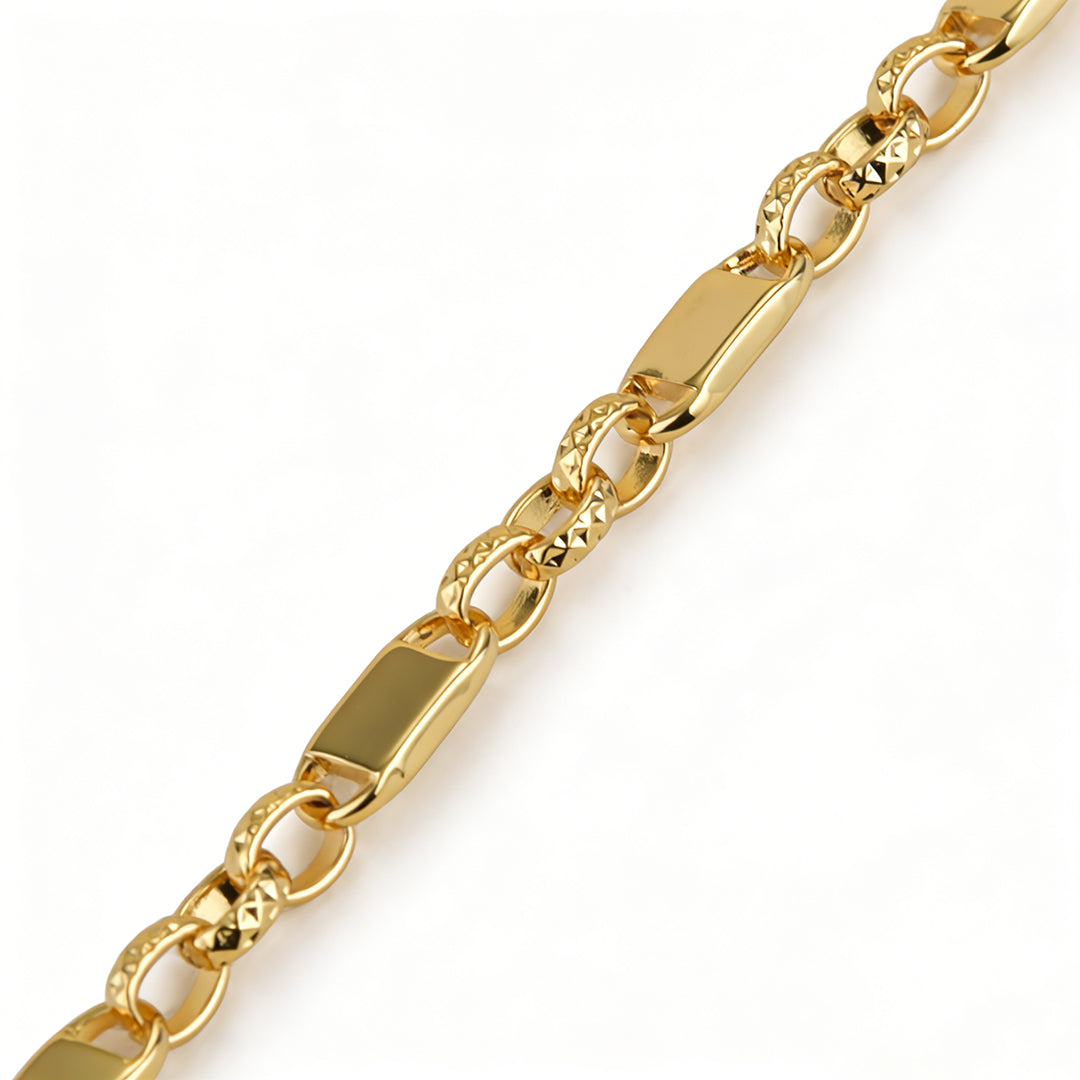 Detailed shot of the 18k gold plated geometric links with textured diamond-cut patterns.