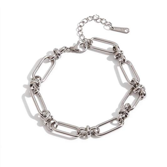 Silver-tone geometric link chain bracelet arranged in a circle on a white background
