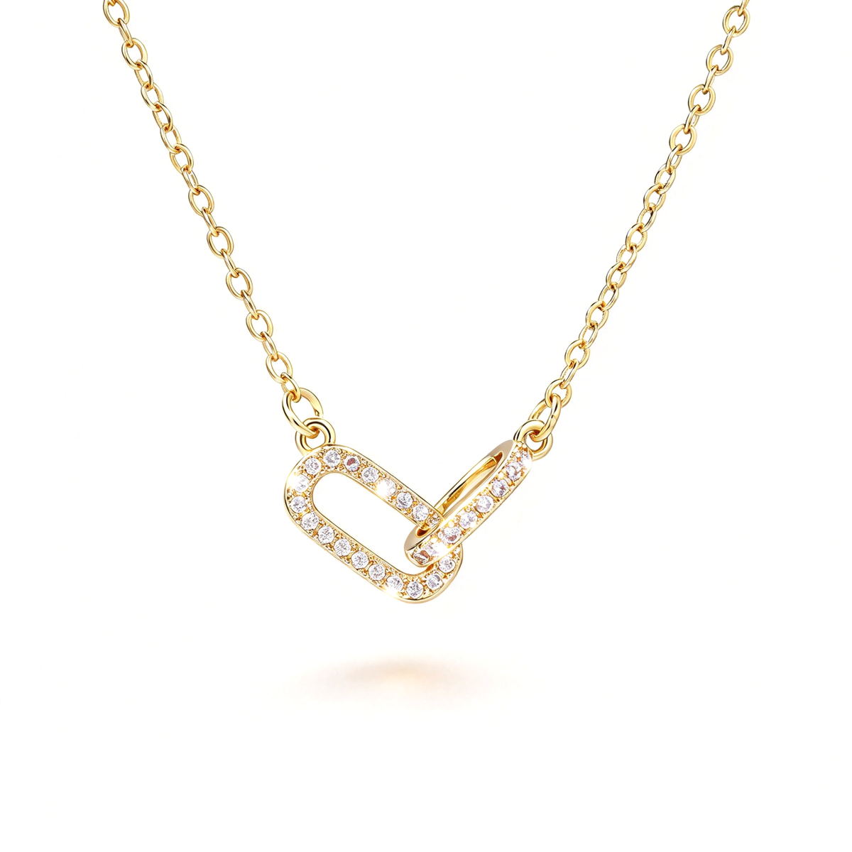 Gold-tone geometric link pendant necklace with an interlocking pendant and delicate chain.