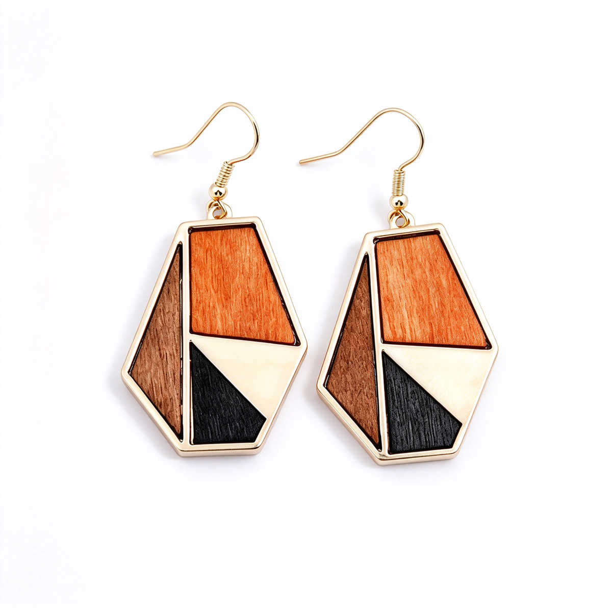 Angular orange dangle earrings with small black triangular accents and gold-tone outlines.