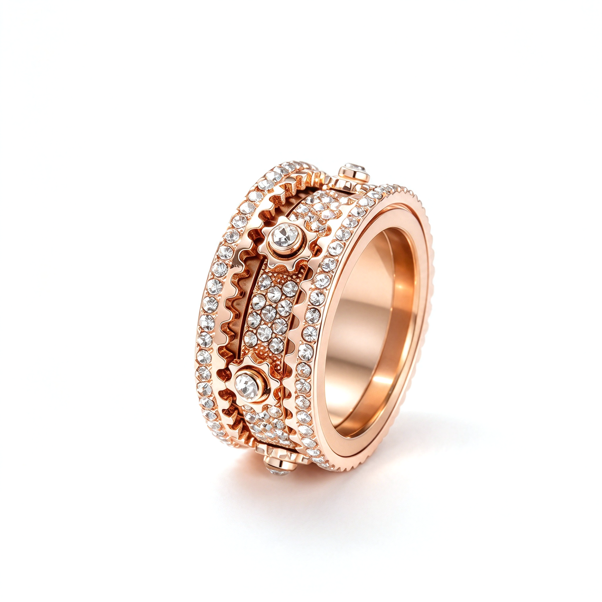 Geometric rotating gear statement ring shown at an angled close-up with layered decorative bands.