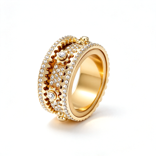 Gold-tone ring shown alone at an angled view, highlighting its raised circular details and patterned bands.