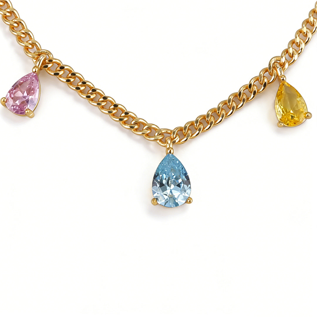Close-up details of a gold pendant necklace for women with a radiant gold finish.
