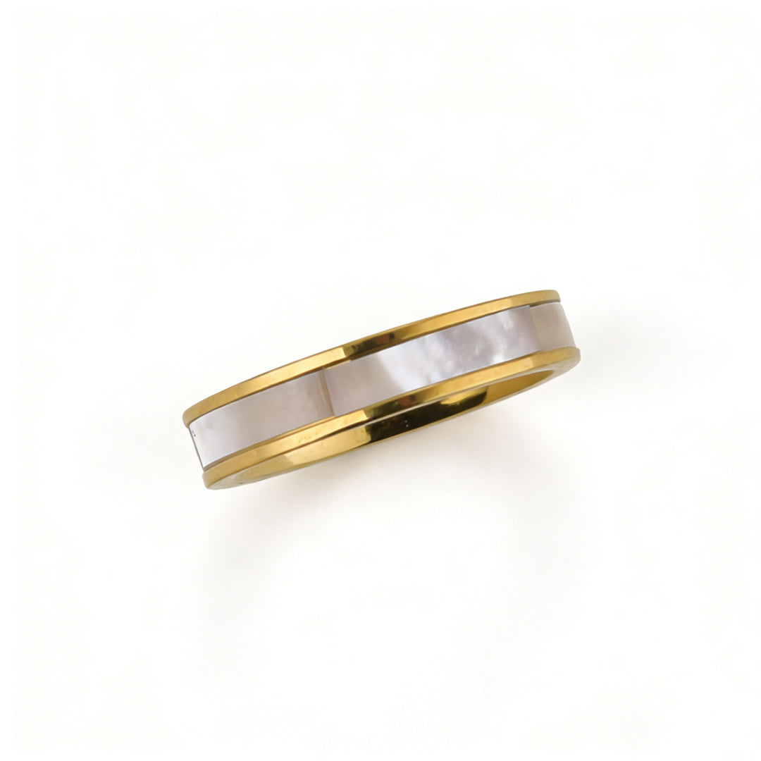 Detailed shot of the iridescent natural shell and vacuum-plated gold finish on a stainless steel ring.