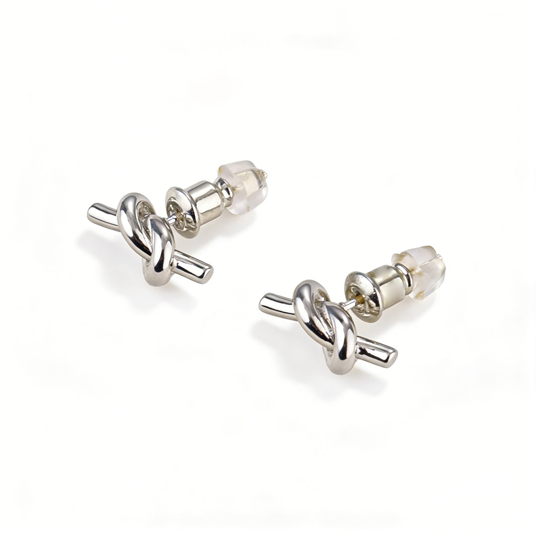 Gold stud earrings in a twisted knot style, an ideal tarnish-resistant jewelry gift for her.