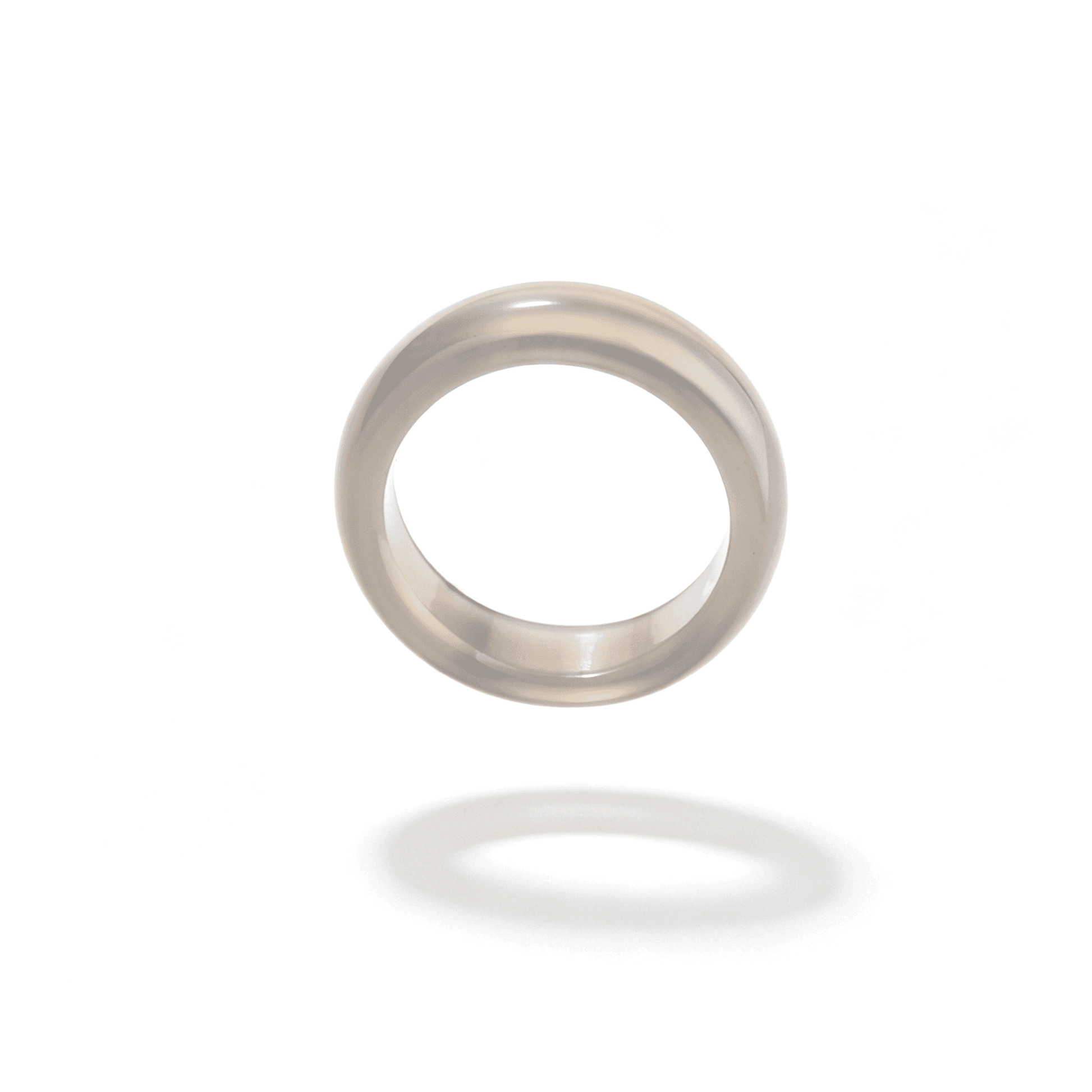 Side view of a slim gray chalcedony ring, showcasing its minimalist natural stone design and misty, high-shine luster.