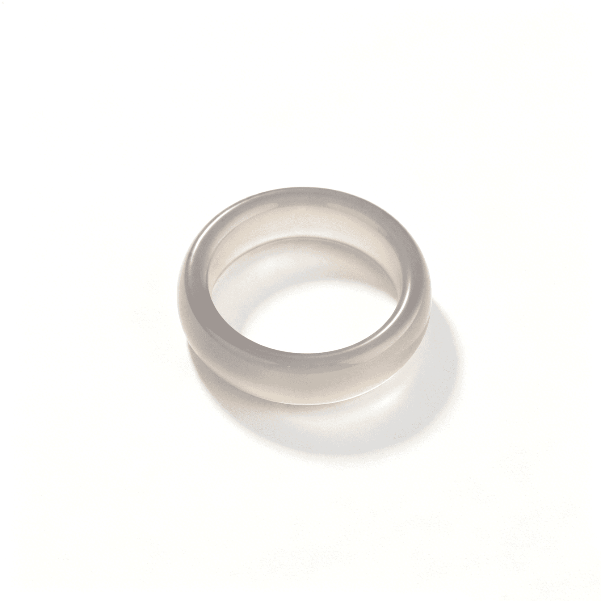 An angled shot of the smoky gray chalcedony ring, highlighting its semi-transparent organic texture and elegant slim profile.