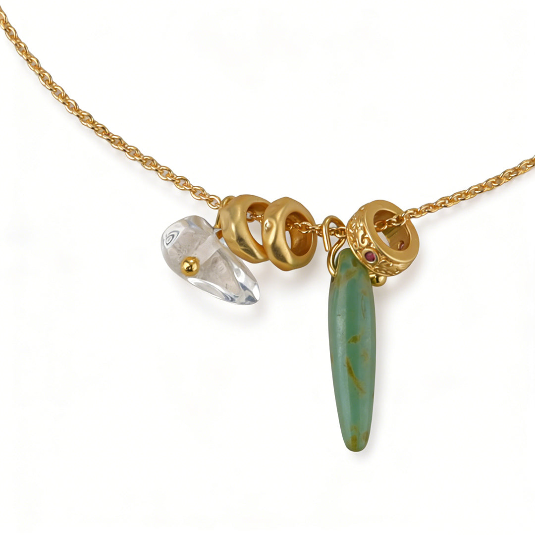 Delicate green crystal necklace with high-polish 18k gold plated spacer beads.