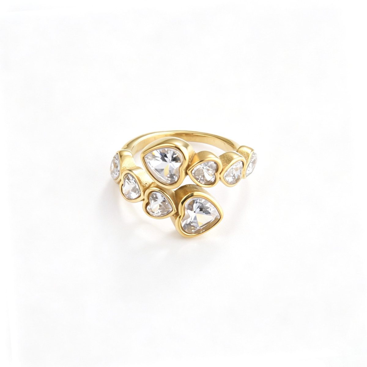Heart accent cuff ring shown from a front angled view with varying heart-shaped details