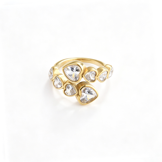 Heart accent cuff ring shown from a front angled view with varying heart-shaped details