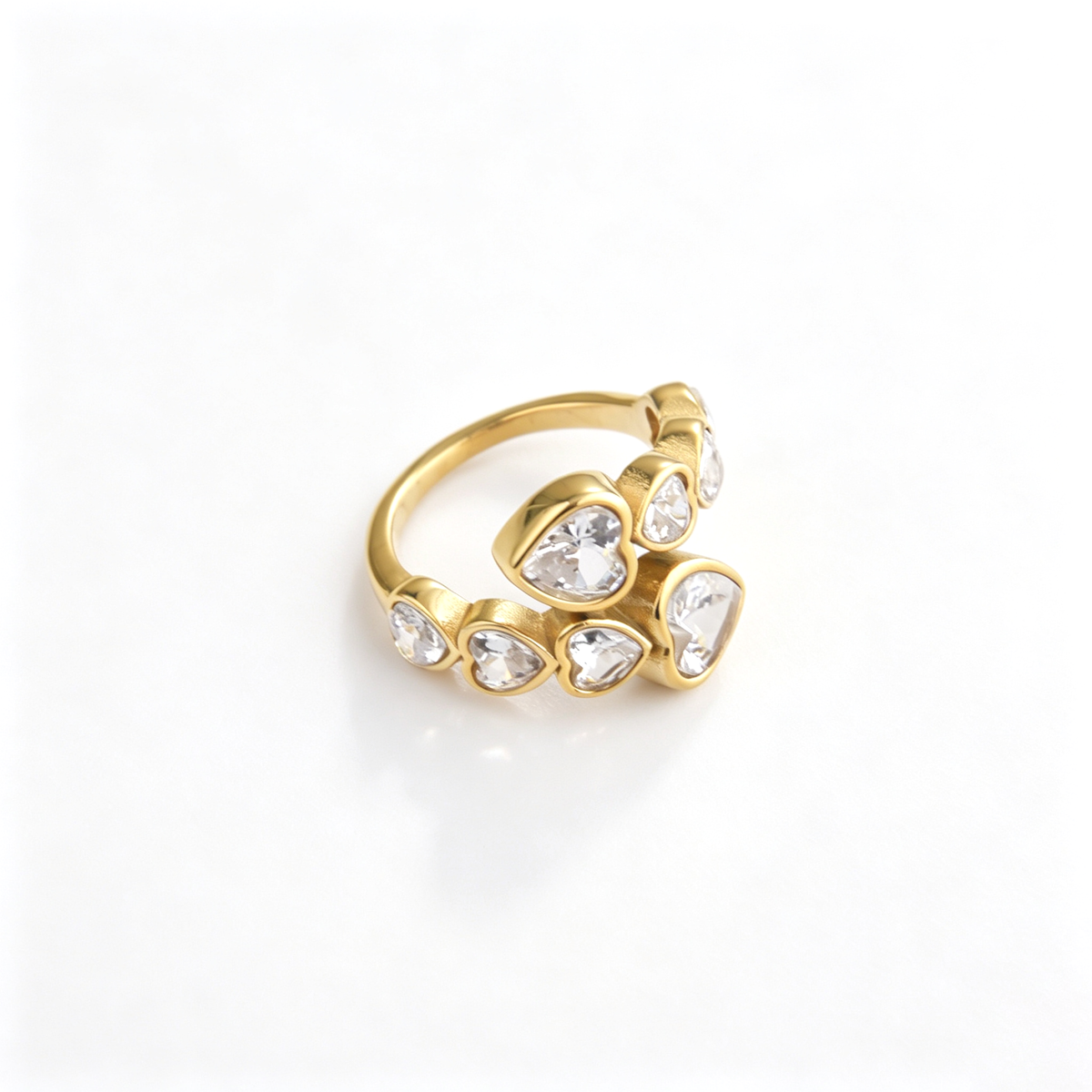 Heart cuff ring shown from the rear, revealing the open band and decorative heart details