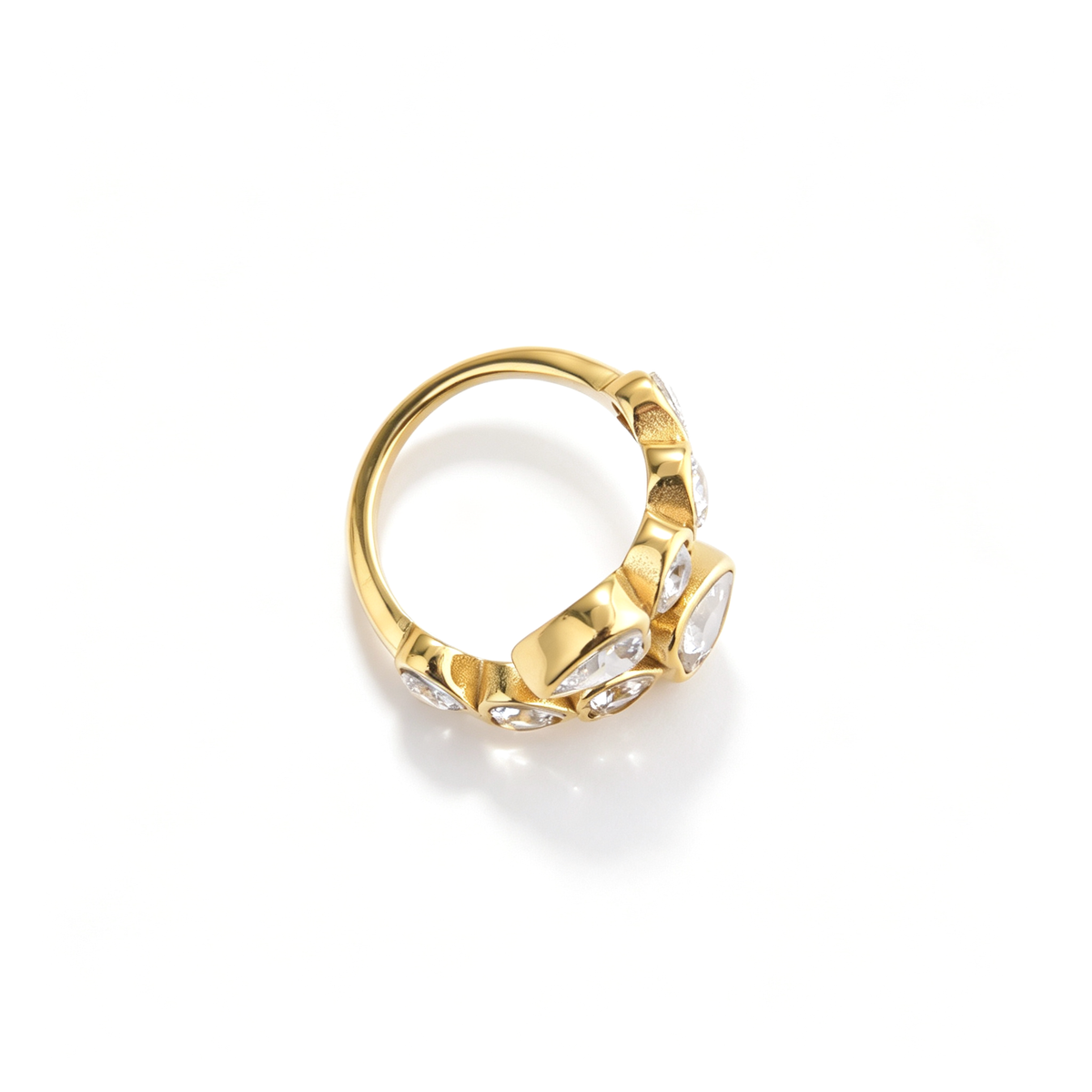 Heart accent ring shown from a three-quarter angle with layered heart-shaped decorative details