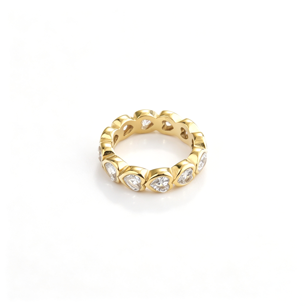 Heart band ring shown from an angled front view with repeating heart-shaped settings