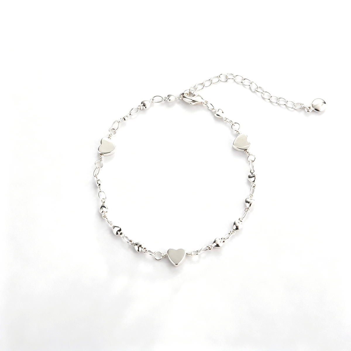 Back view of the heart charm bracelet showing the chain, clasp, and extension