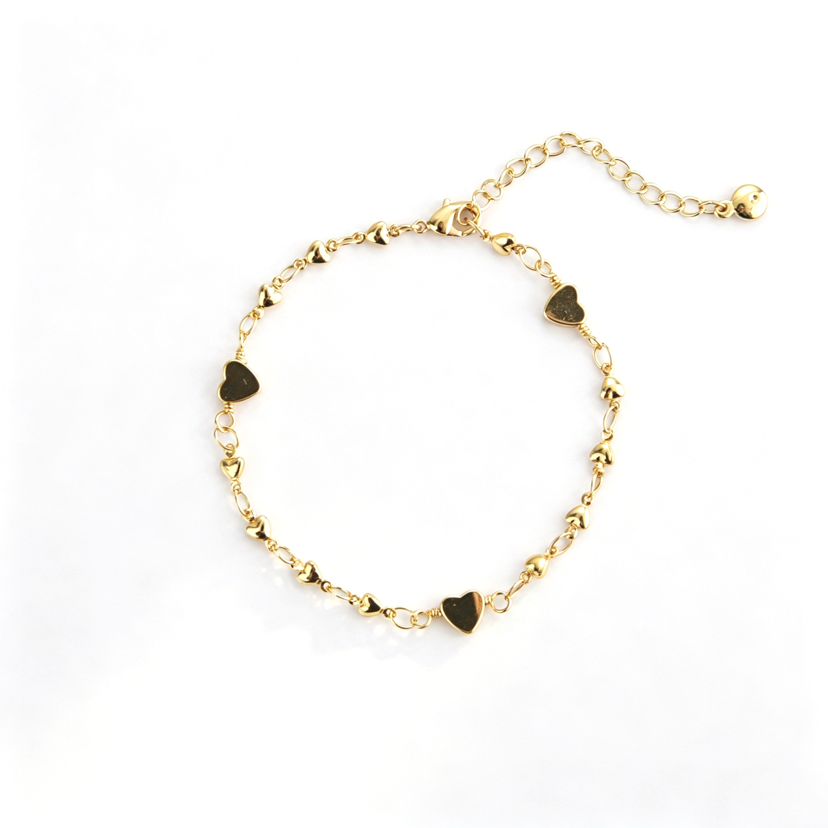 Heart charm bracelet with delicate chain links and multiple heart-shaped charms