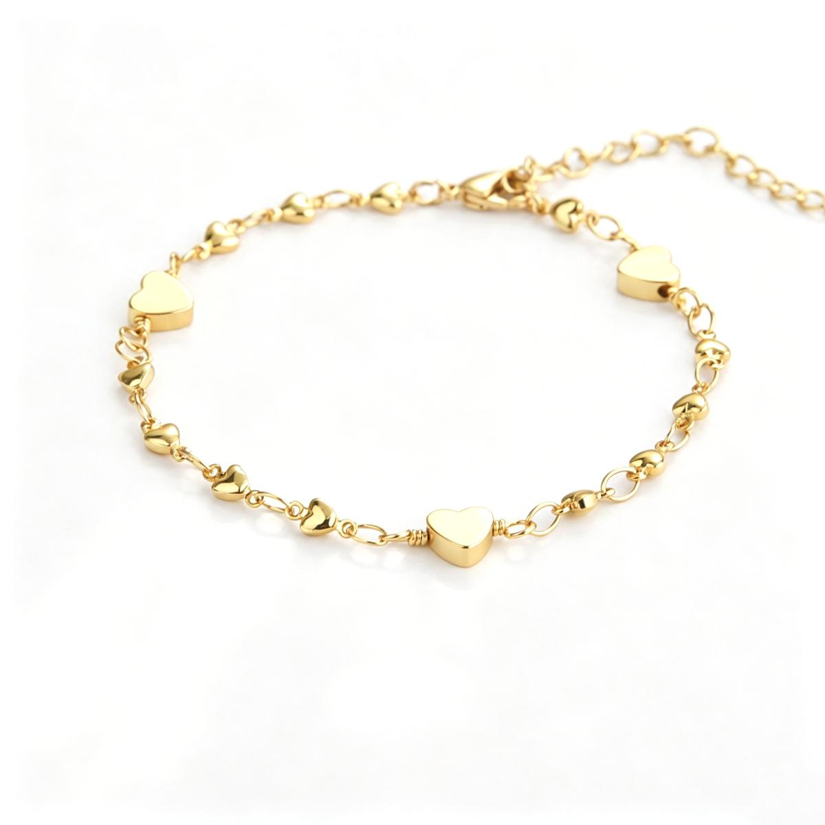 Back view of the heart charm bracelet showing the chain, clasp, and extension