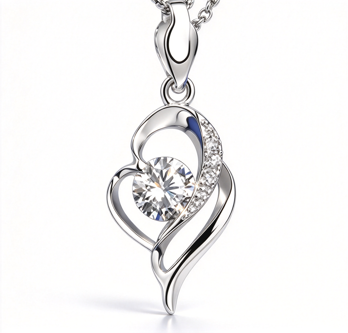Close-up of the heart-inspired pendant showing its curved outline and central decorative stone.