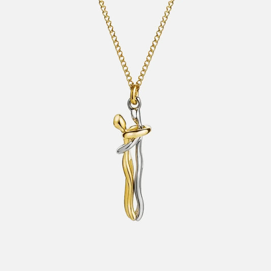 Two-tone stainless steel hug pendant necklace with gold-tone chain on white background