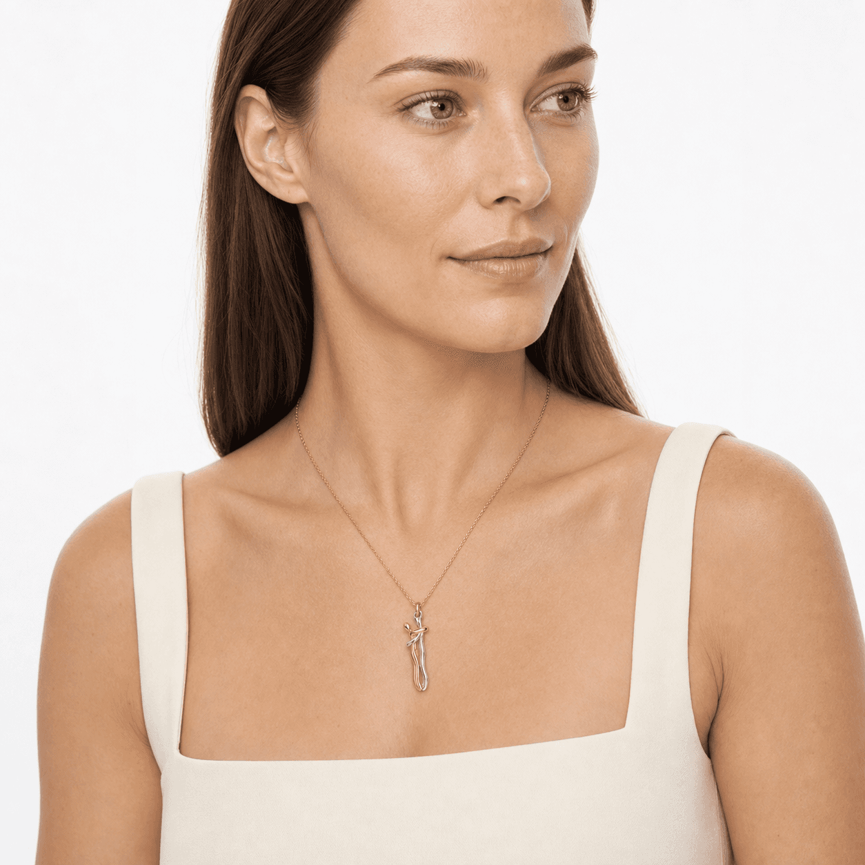 Two-tone stainless steel pendant necklace on a model in an opposing three-quarter view