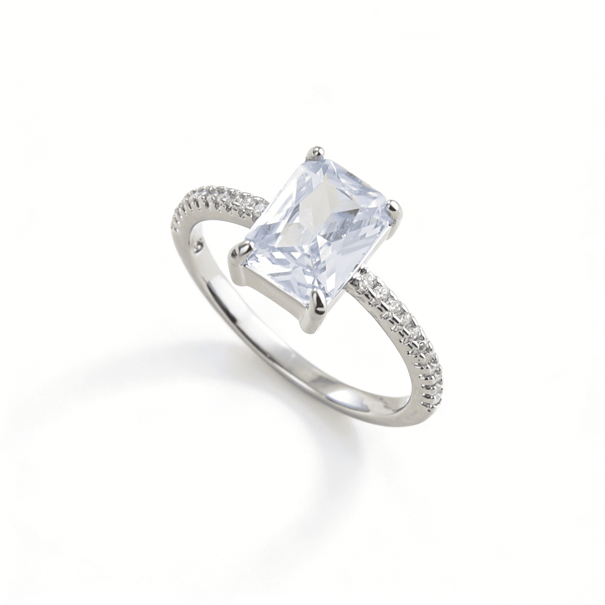 Three-quarter angled view of independent luxury square cut travel ring, perfect as an engagement alternative.