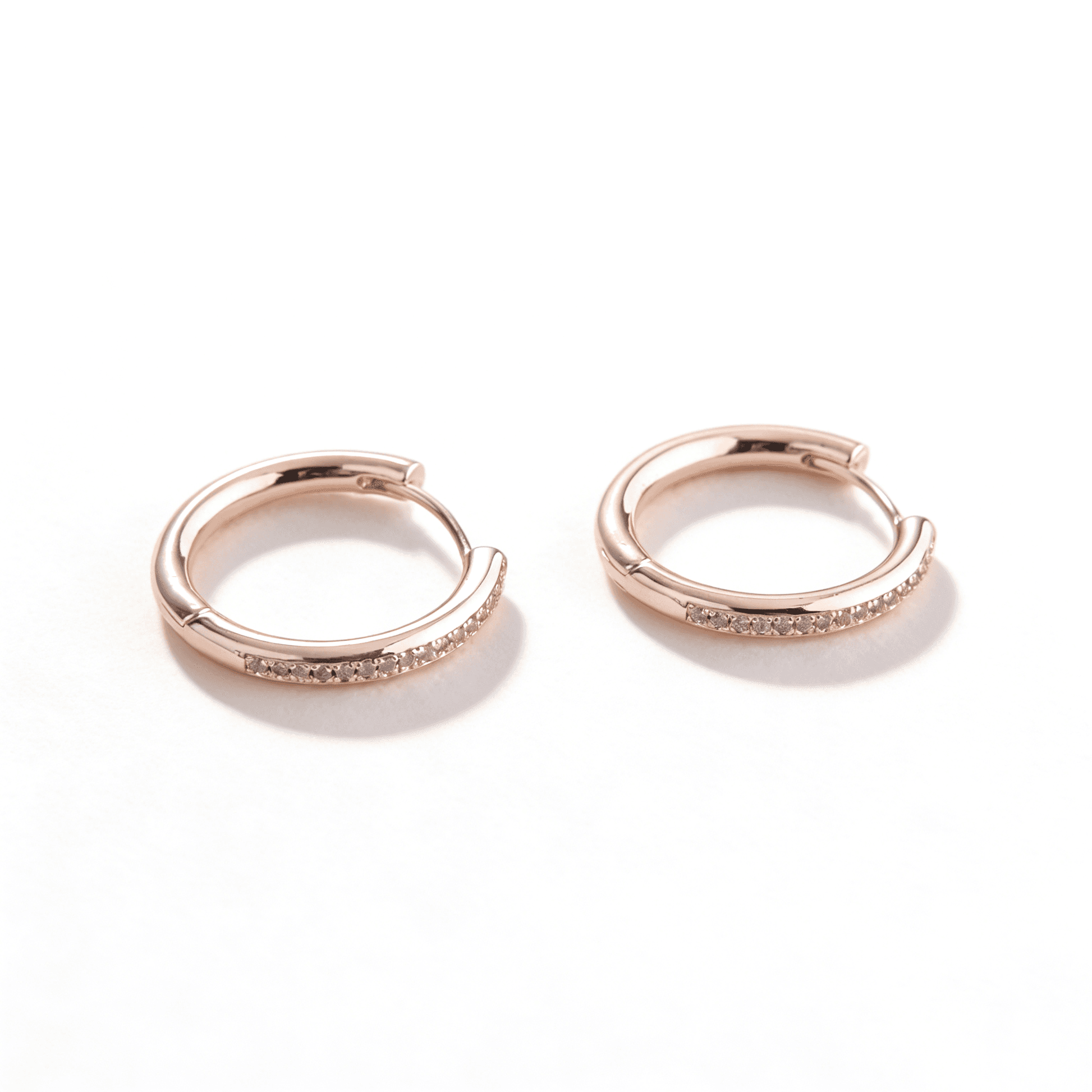 rose gold cubic zirconia hoop earrings representing Ever P.’s commitment to poise.