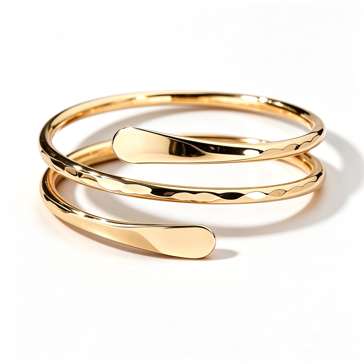 Irregular open cuff ring arranged horizontally to show its sculptural curves and open-ended design