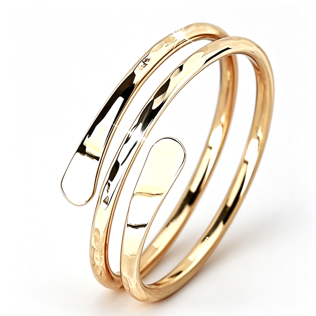 Angled view of an open cuff ring highlighting its overlapping curved bands and polished contours