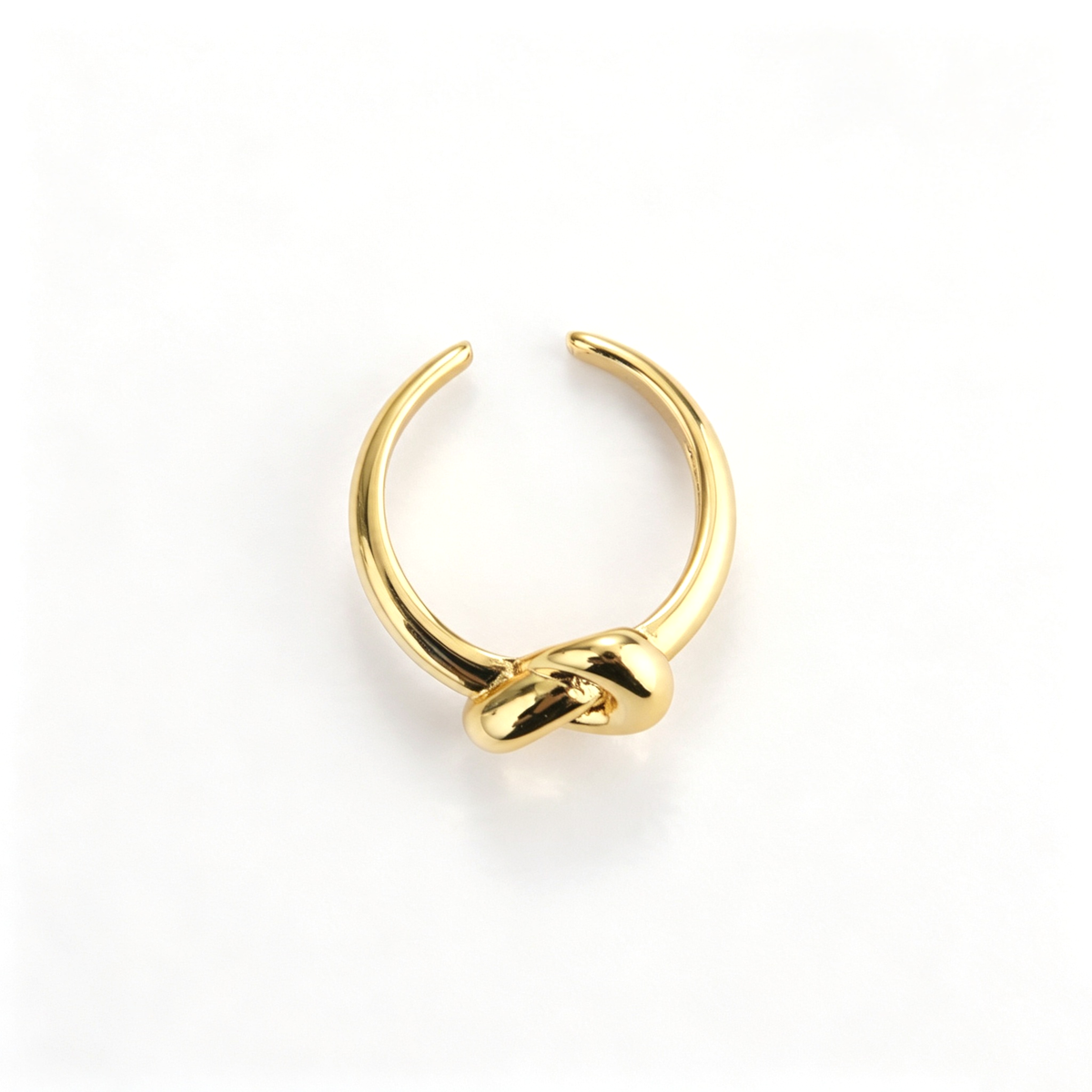 Open cuff ring shown from an angled view, highlighting the intertwined knot detail