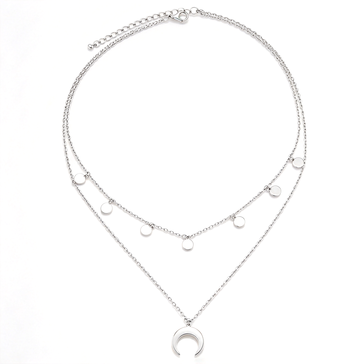 Layered crescent moon necklace displayed flat, showing two chains, round dangling charms, and an open moon pendant.