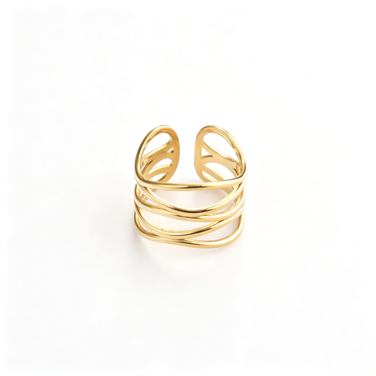 Layered wave cuff ring shown from a front angled view with flowing overlapping bands
