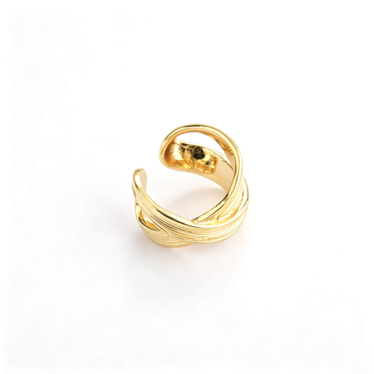 Open cuff ring viewed from the side, showing the layered ribbed band structure