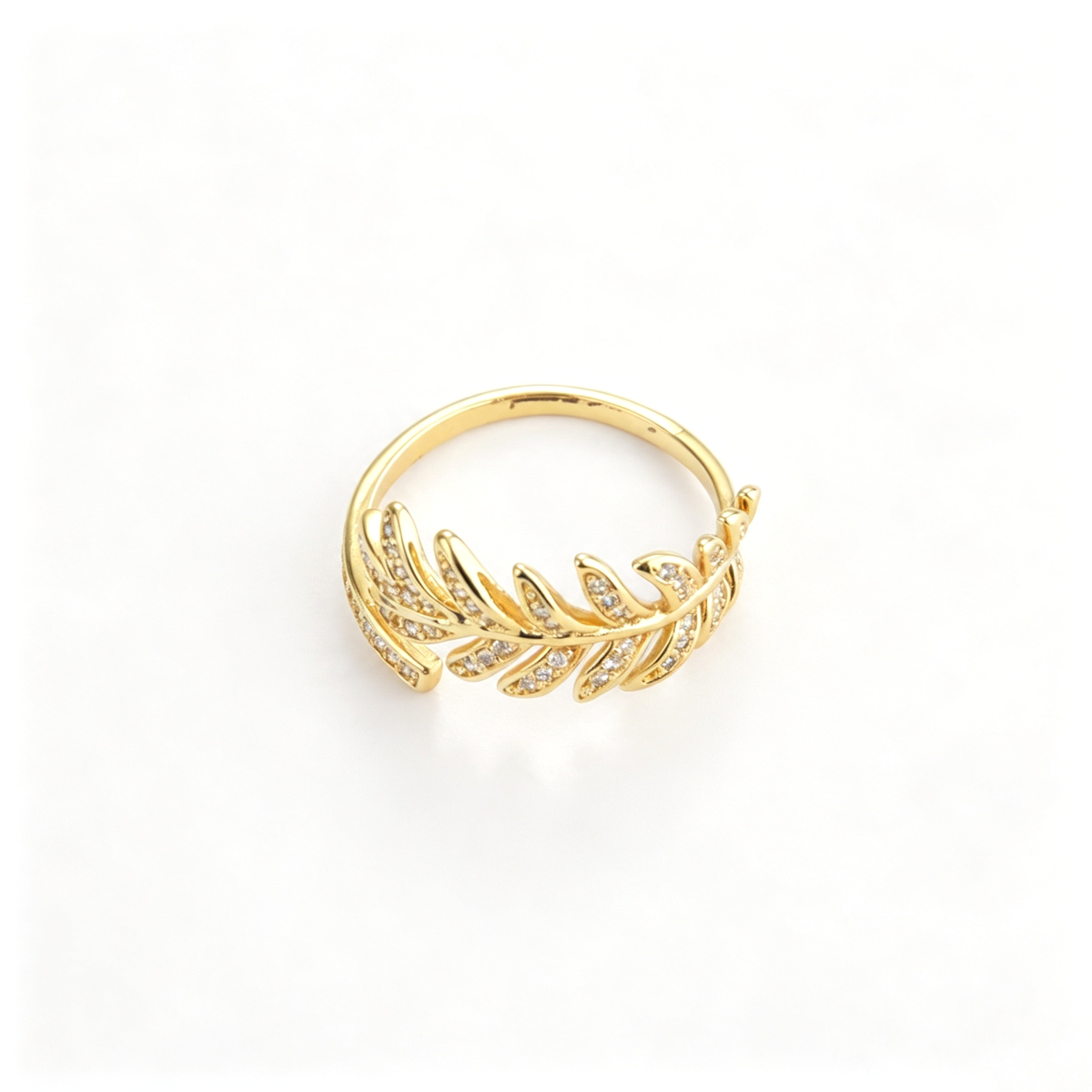 Leaf vine cuff ring with a crystal branch design in an angled view