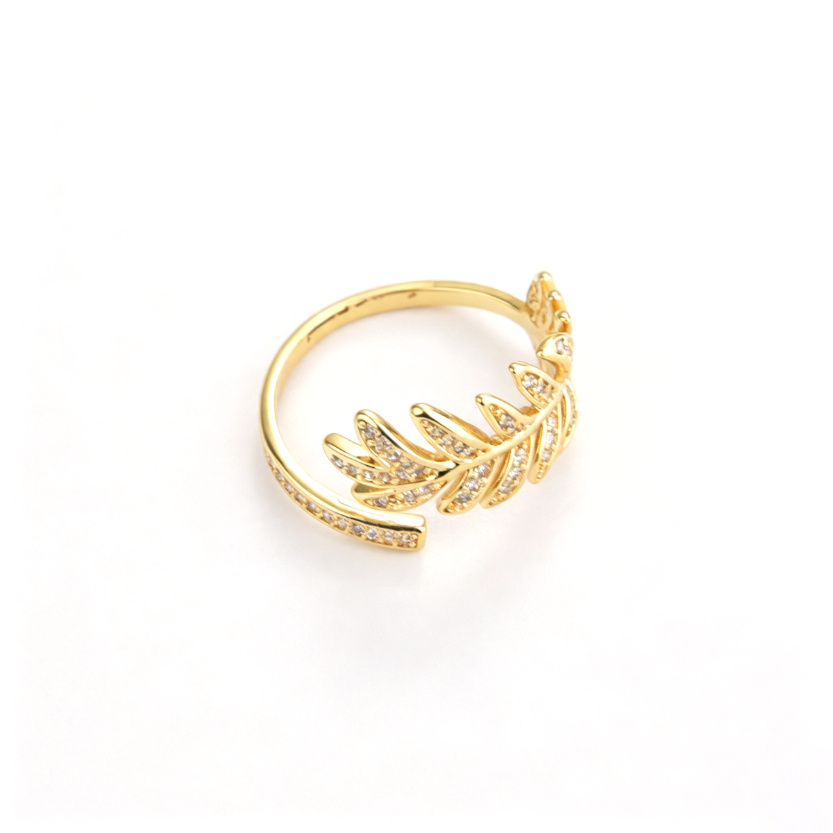 Open cuff ring shown from above, highlighting the curved band and leaf details
