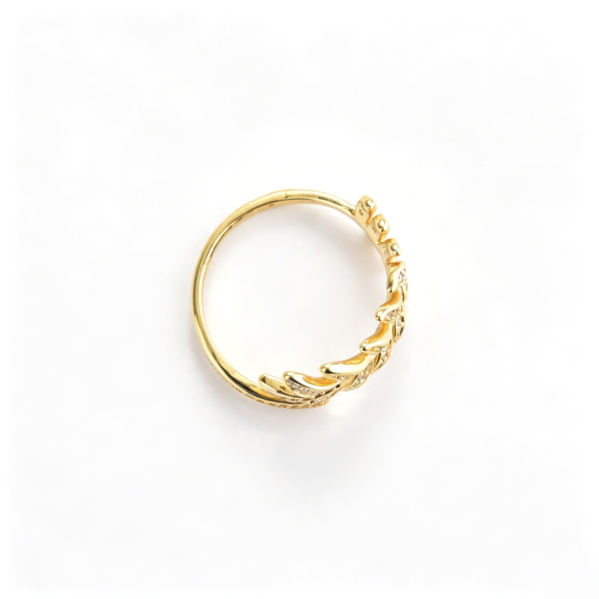 Leaf cuff ring viewed from the back, showing the open ends and inner band