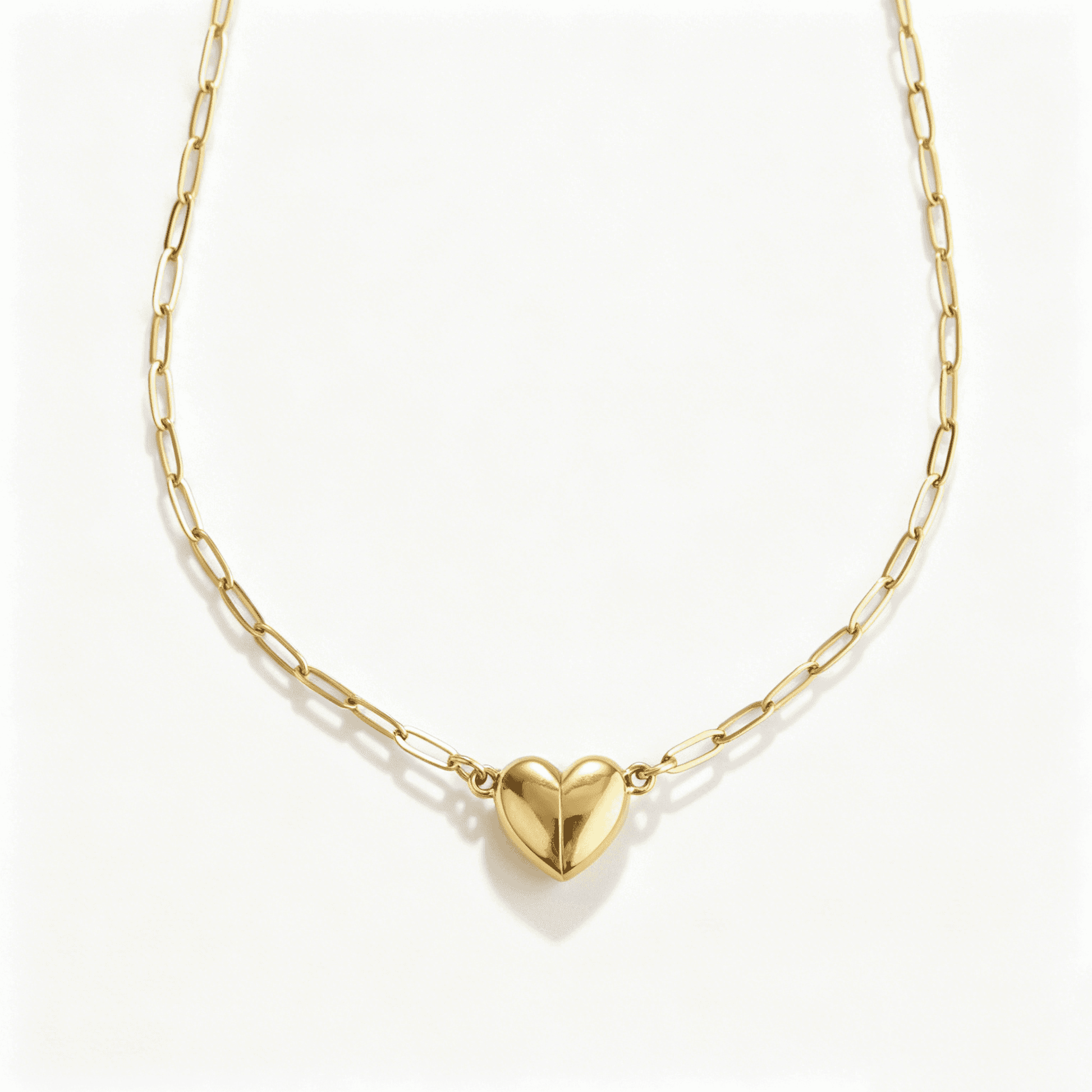 Chest view of the connected magnetic heart pendant on a paperclip chain, suitable for matching necklaces for couples.