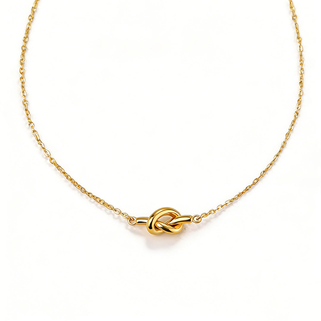 Ever P. minimalist gold necklace with a unique irregular molten pendant.