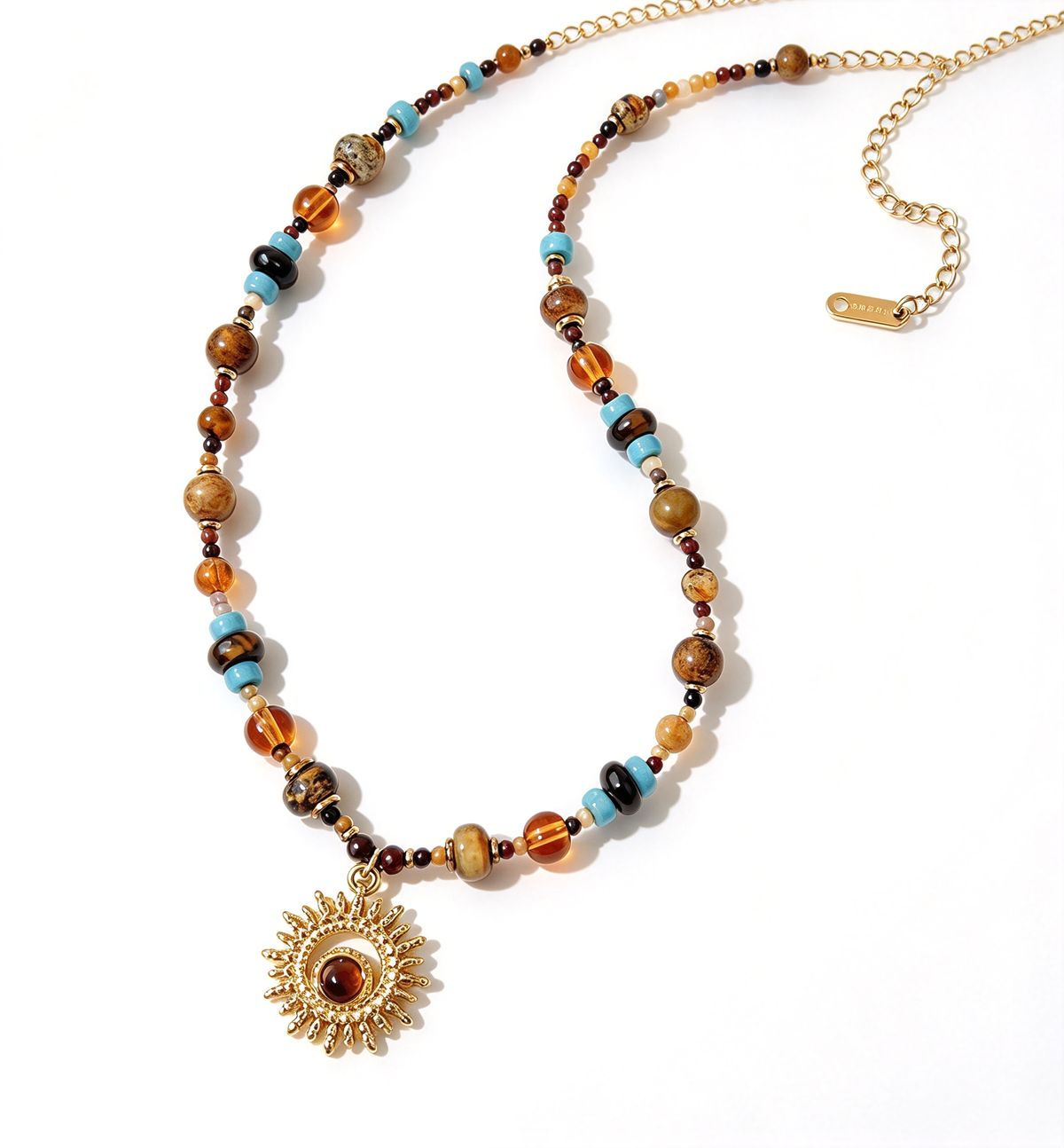 Multicolor beaded sunburst pendant necklace displayed on a white background with the full chain and pendant visible.